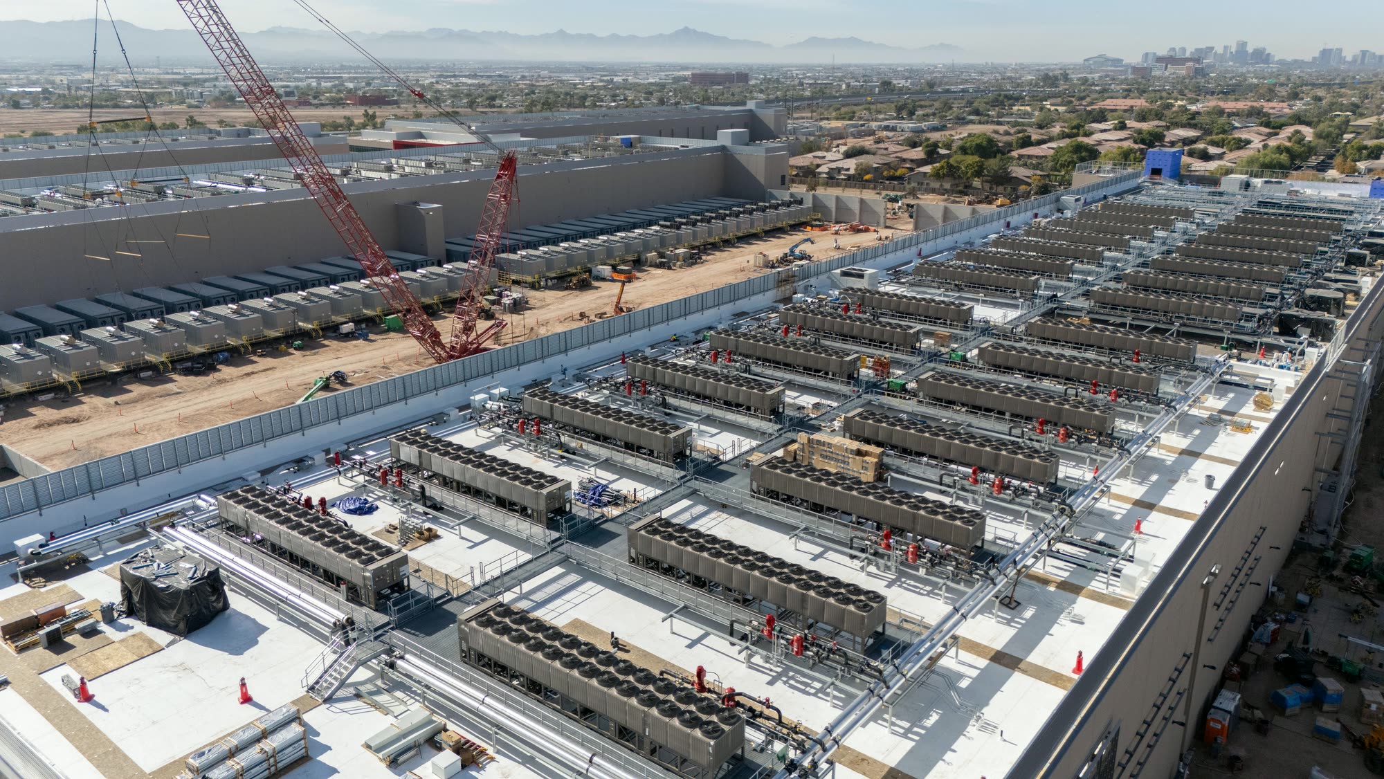 Aerial view of rooftop chiller plant being installed on a data centre under construction